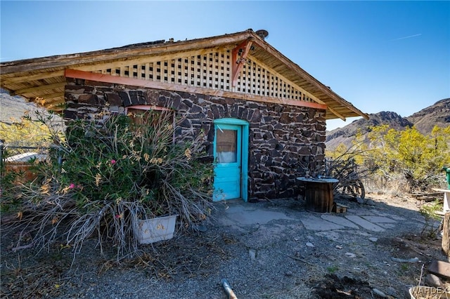 view of outdoor structure featuring a mountain view