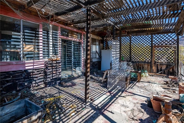 view of patio / terrace featuring a pergola and outdoor dining area