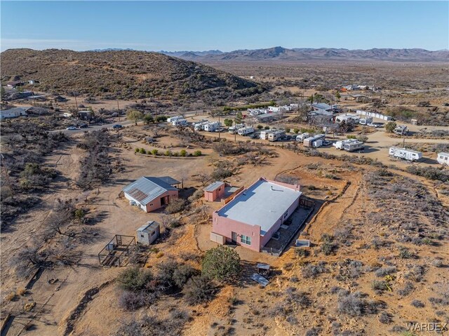 aerial view featuring a mountain view and a desert view