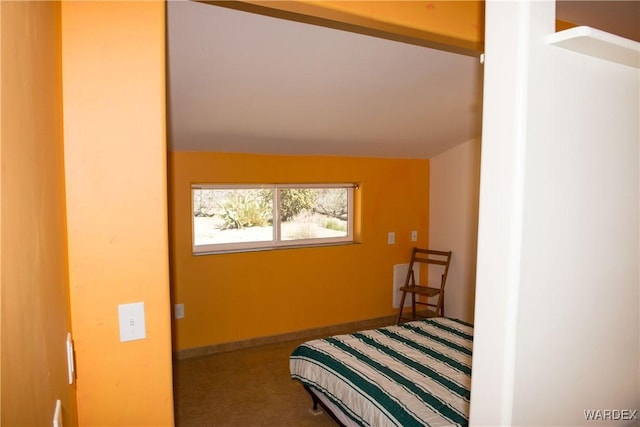 bedroom with carpet and baseboards