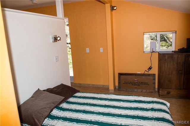 bedroom featuring lofted ceiling