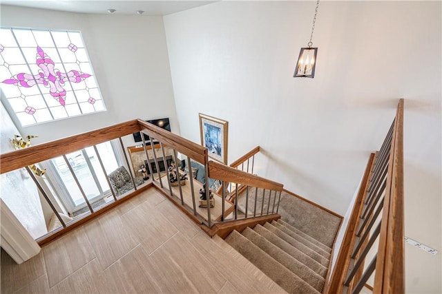 1800 Clubhouse Dr Unit D41, Bullhead City, AZ 86442 - staircase featuring a chandelier and a high ceiling
