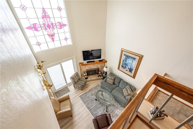 1800 Clubhouse Dr Unit D41, Bullhead City, AZ 86442 - living room with a glass covered fireplace, wood finished floors, and a high ceiling