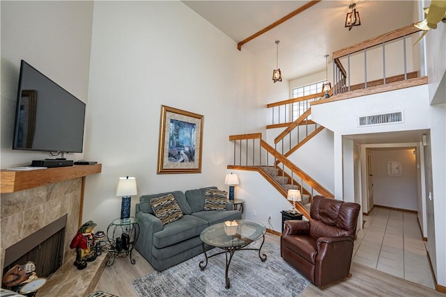 1800 Clubhouse Dr Unit D41, Bullhead City, AZ 86442 - living room featuring high vaulted ceiling, stairway, wood finished floors, and a fireplace