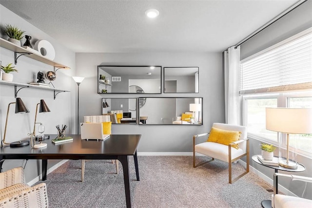 office area with plenty of natural light and carpet floors