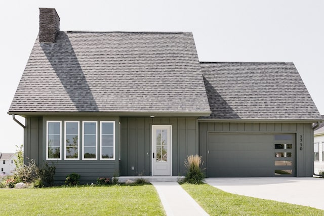 single story home featuring a front yard and a garage