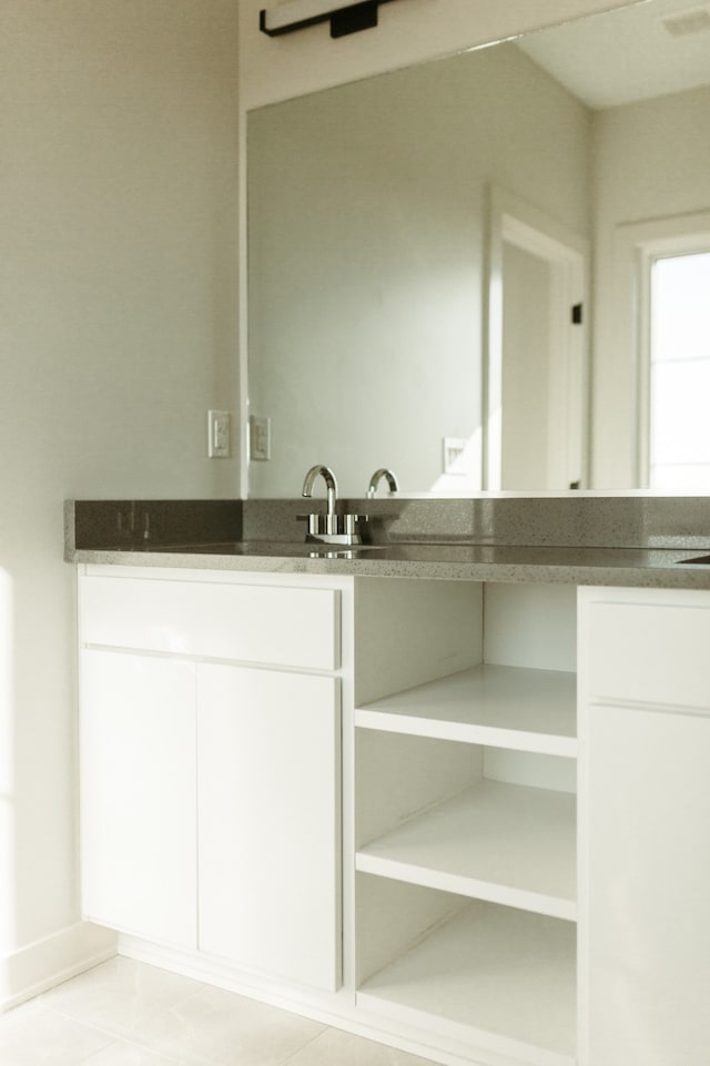 bathroom with tile patterned flooring