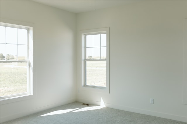 unfurnished room with carpet flooring