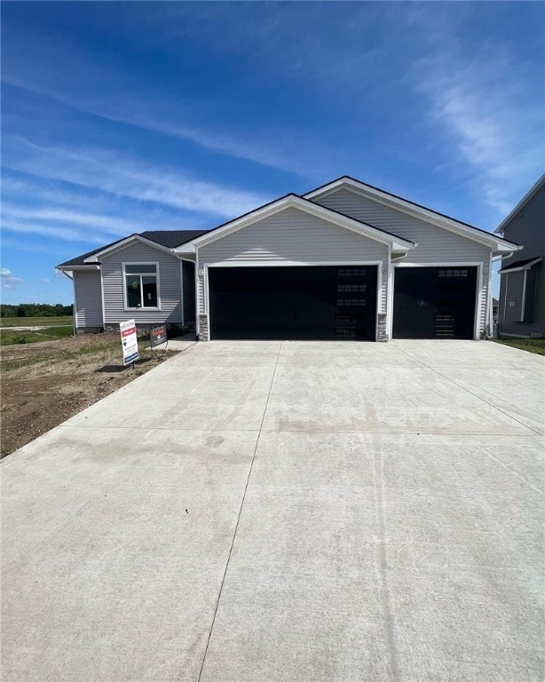 ranch-style home featuring a garage