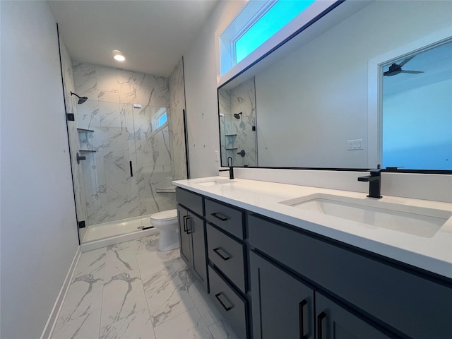 bathroom with toilet, vanity, ceiling fan, and walk in shower