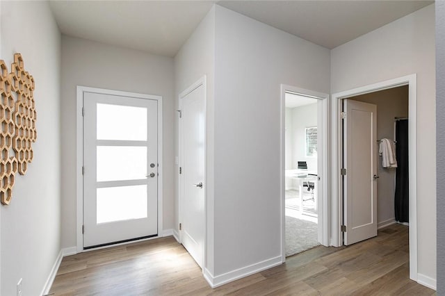 entrance foyer featuring light hardwood / wood-style floors