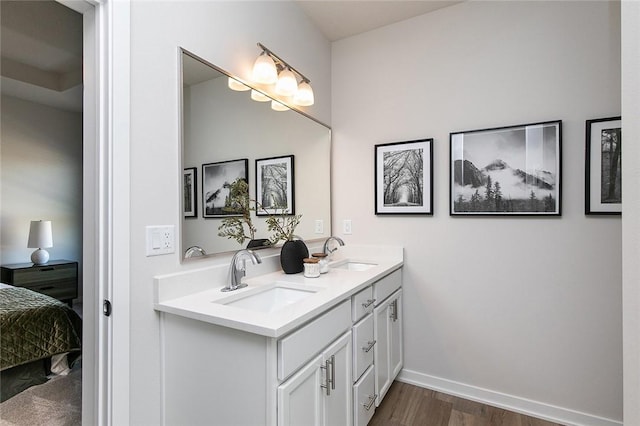 bathroom with hardwood / wood-style flooring and vanity