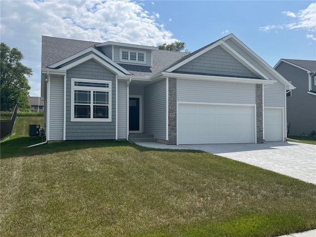 view of front of property featuring a front lawn and central AC unit