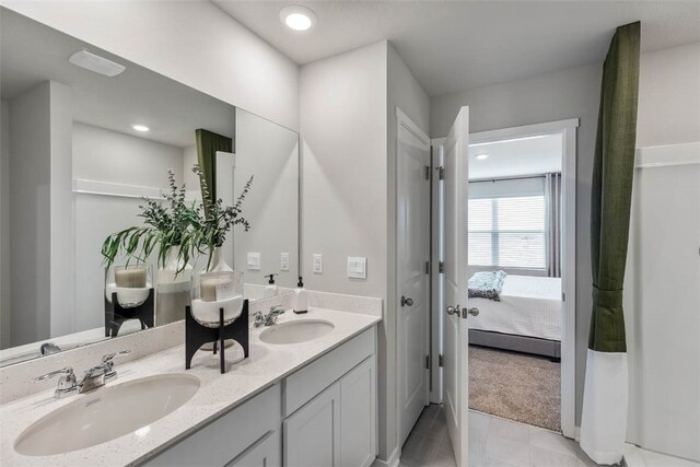 bathroom with vanity and tile patterned floors