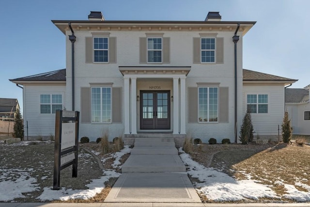 italianate house featuring french doors