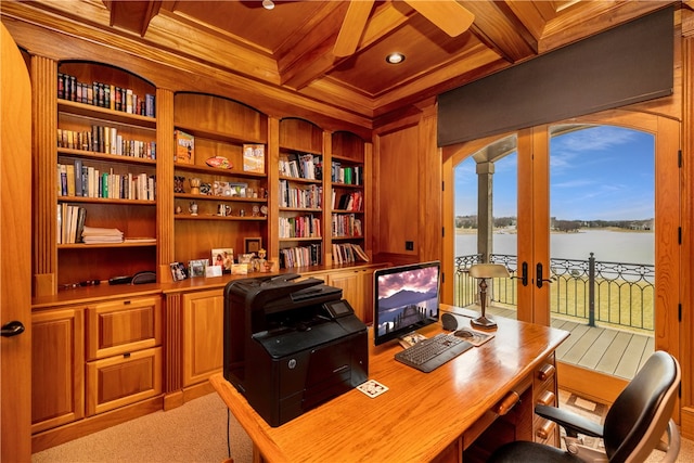 carpeted office space featuring coffered ceiling, a water view, beam ceiling, wooden ceiling, and french doors