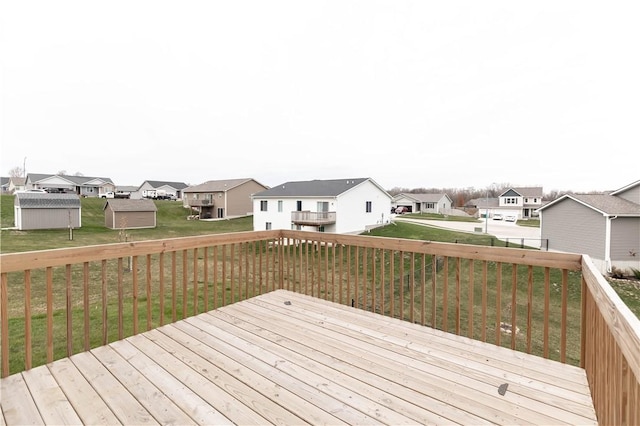 wooden terrace with a yard