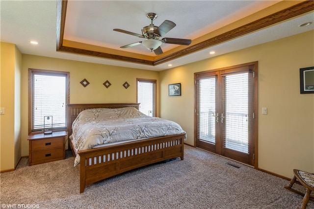 bedroom featuring access to exterior, multiple windows, carpet flooring, and french doors