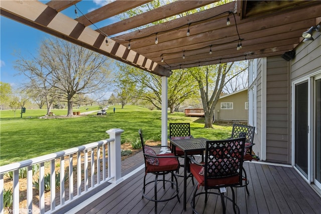 wooden terrace with a pergola and a lawn