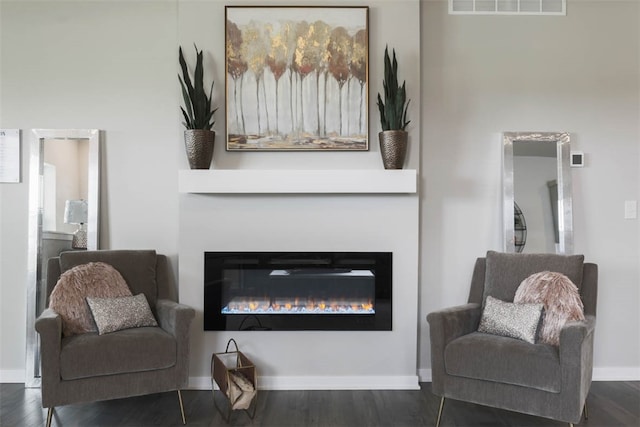 living area featuring dark hardwood / wood-style flooring