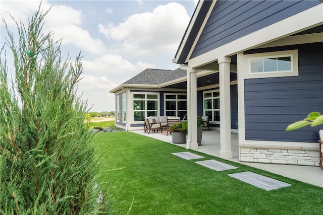 view of yard with outdoor lounge area and a patio area