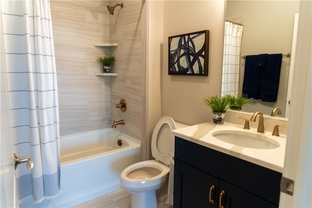 full bathroom with vanity, shower / bath combo with shower curtain, and toilet