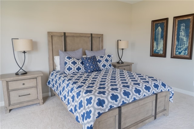 bedroom featuring light colored carpet