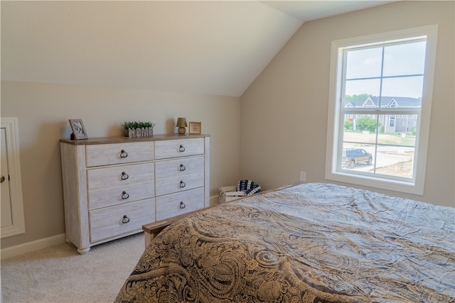 carpeted bedroom featuring vaulted ceiling