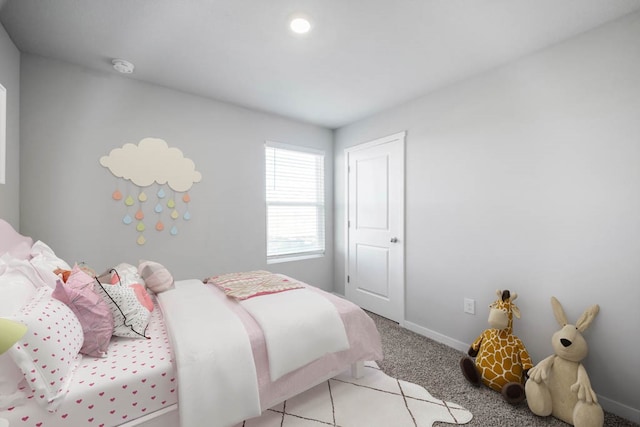 bedroom featuring light carpet