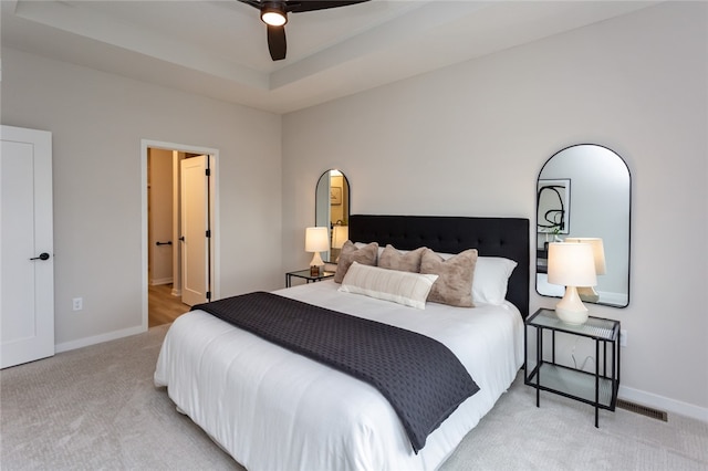 bedroom featuring ceiling fan and light carpet