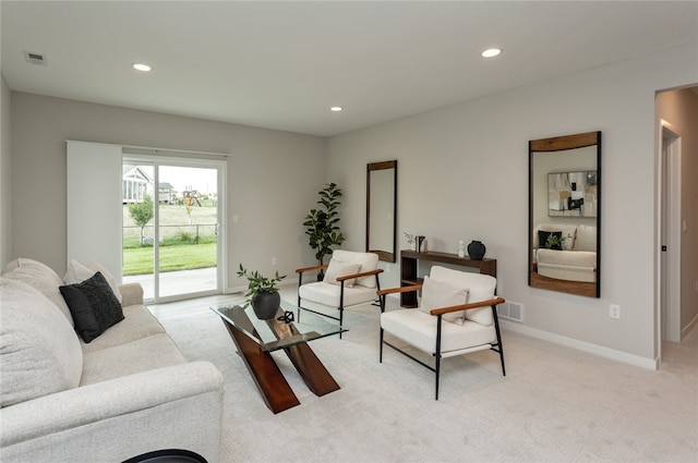 living room featuring light carpet