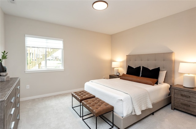 bedroom featuring light carpet