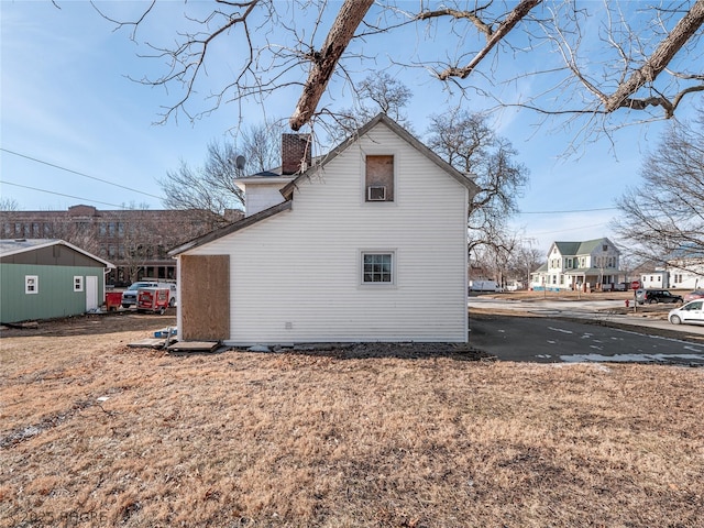 view of home's exterior featuring a yard