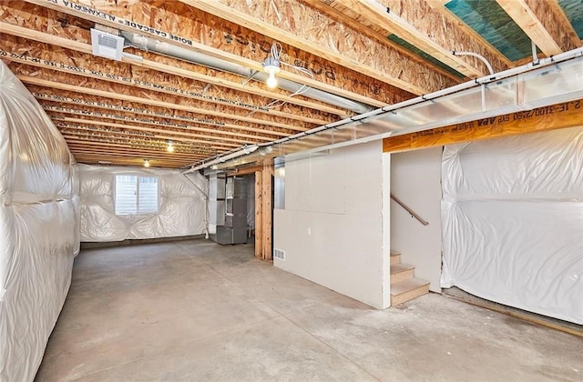 basement featuring heating unit