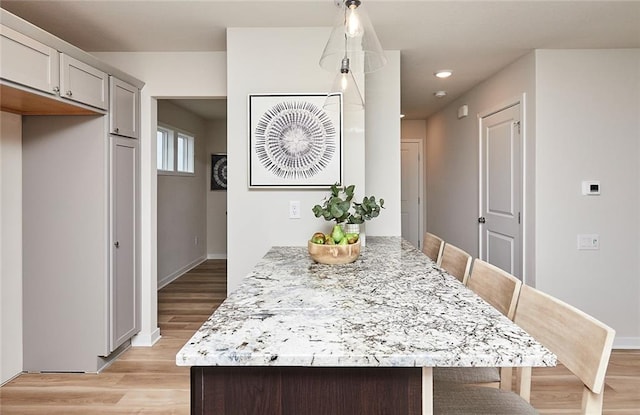 dining space with light wood-type flooring