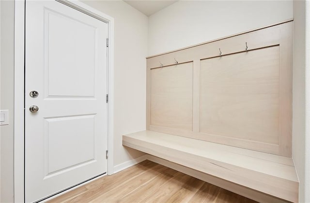 mudroom with light hardwood / wood-style flooring