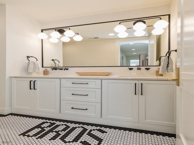 bathroom featuring dual bowl vanity and tile patterned flooring