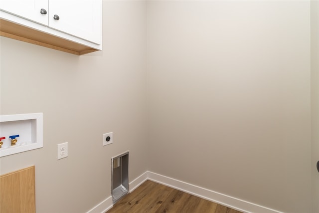 laundry area with cabinets, hookup for an electric dryer, hookup for a washing machine, and dark wood-type flooring