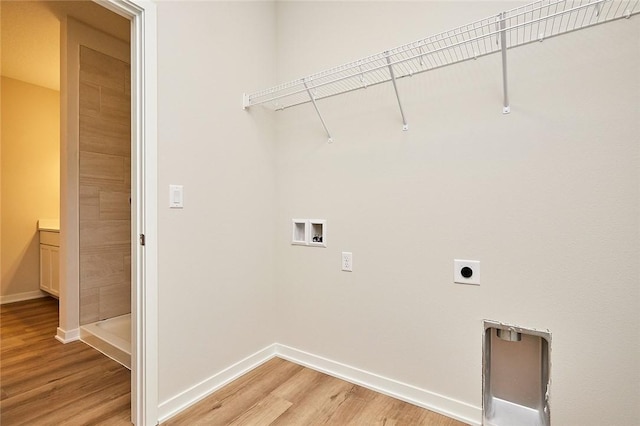 laundry area featuring hookup for a washing machine, electric dryer hookup, and wood-type flooring