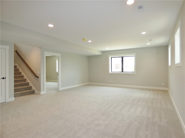 empty room with light colored carpet