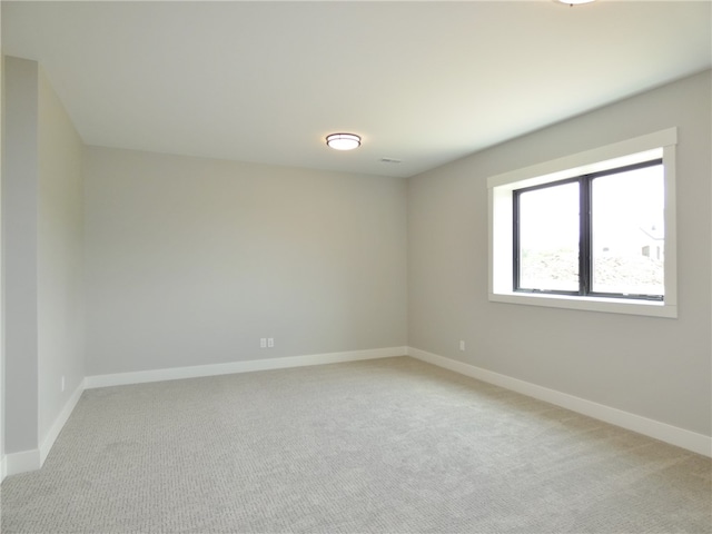 empty room featuring light carpet