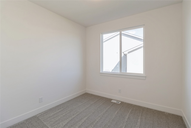 empty room with carpet flooring