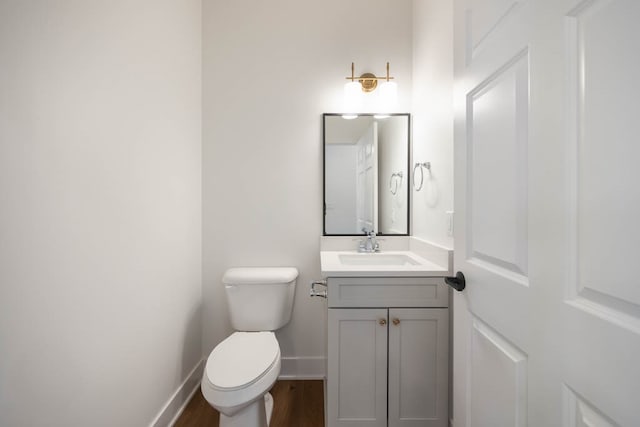 2814 NW Westwood Ct, Ankeny, IA 50023 - bathroom featuring oversized vanity, toilet, and wood-type flooring