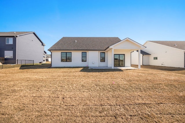 2814 NW Westwood Ct, Ankeny, IA 50023 - rear view of house with a lawn and a patio