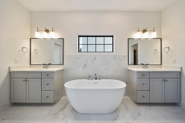 2814 NW Westwood Ct, Ankeny, IA 50023 - bathroom featuring tile walls, dual bowl vanity, tile flooring, and a tub