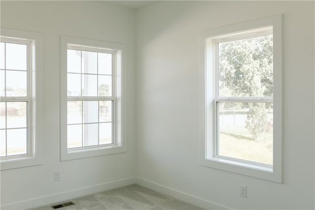 spare room with light colored carpet