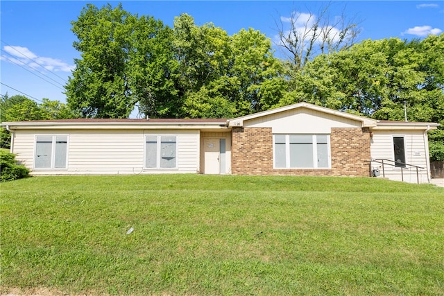 rear view of house with a lawn