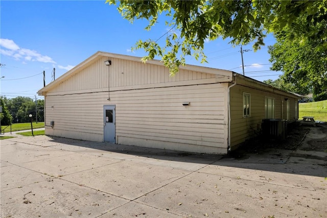 view of side of home featuring cooling unit