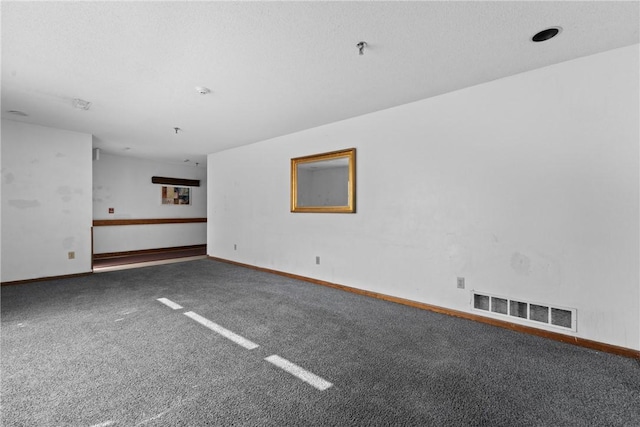 carpeted empty room featuring visible vents and baseboards