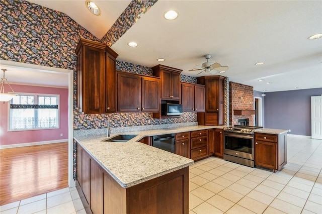 kitchen featuring sink, ceiling fan, black appliances, light stone countertops, and kitchen peninsula